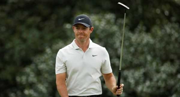 McIlroy battles swirling winds to stay in contention halfway through Masters