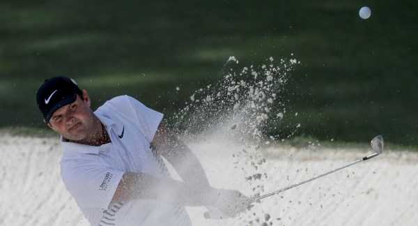 McIlroy battles swirling winds to stay in contention halfway through Masters