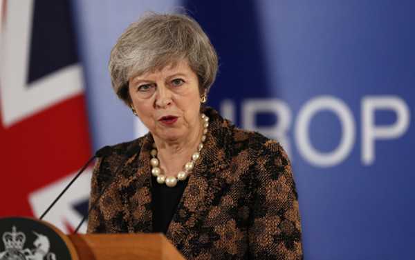 May Thanks Military for Keeping UK From "Russian Intrusion" in Christmas Address