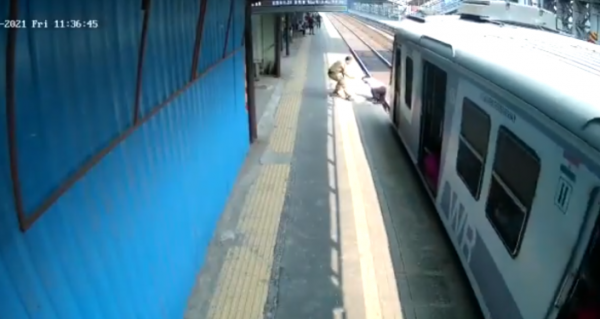 Watch Indian Cop Scold Man After Saving Him from Being Run Over by a Train