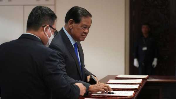 Cambodian lawmakers approve changes to election law that disqualify candidates who don’t vote