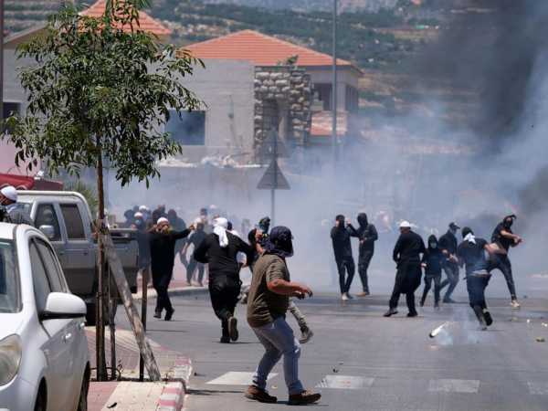 Israeli police clash with Druze protesters in the Golan Heights. The rare violence leaves 20 injured