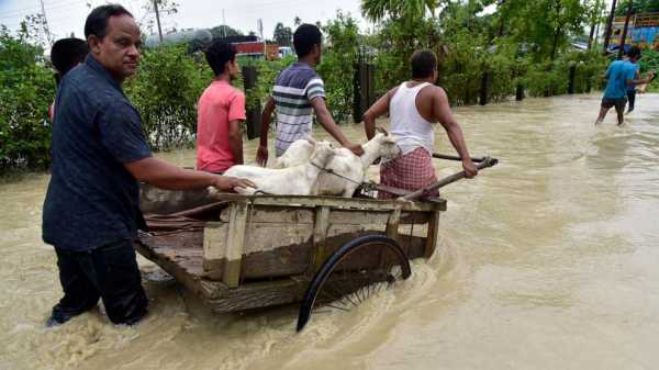 Flooding displaces tens of thousands and kills 1 as heavy monsoon rains batter Indian villages