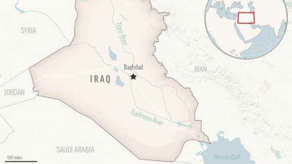 Power station fire, explosions cut off power in much of Iraq in scorching summer heat, officials say