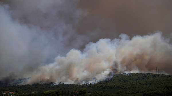 Wildfires in Greece close highways and threaten an oil refinery, as the EU sends firefighting planes