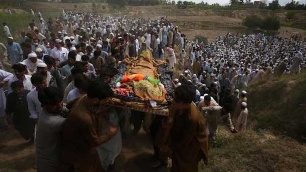 Pakistan buries dead from massive suicide attack at political rally that killed 54