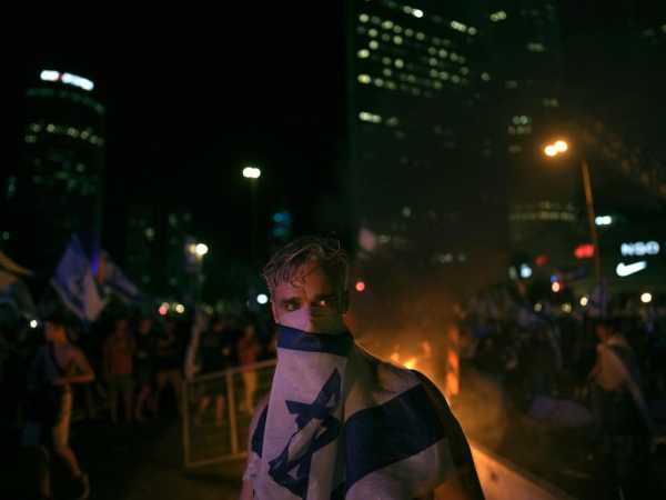 AP PHOTOS: Unrest grips Israel as the parliament adopts a law weakening the Supreme Court