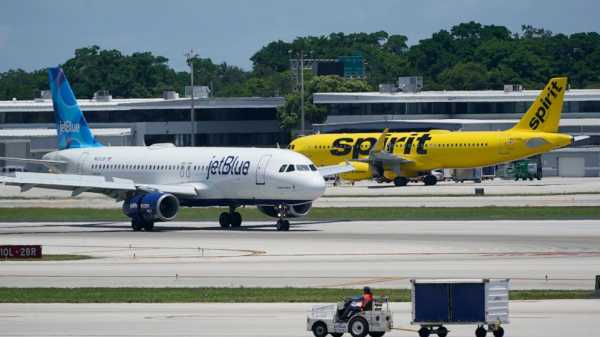 In court documents, JetBlue says it could raise fares on some routes after buying Spirit Airlines