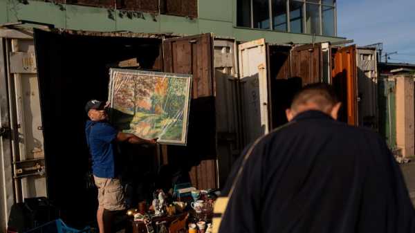 A cherished weekend flea market in the Ukrainian capital survives despite war