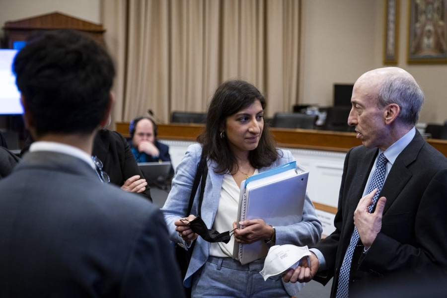 FTC chair Lina Khan and SEC chair Gary Gensler have an aside after a House hearing.