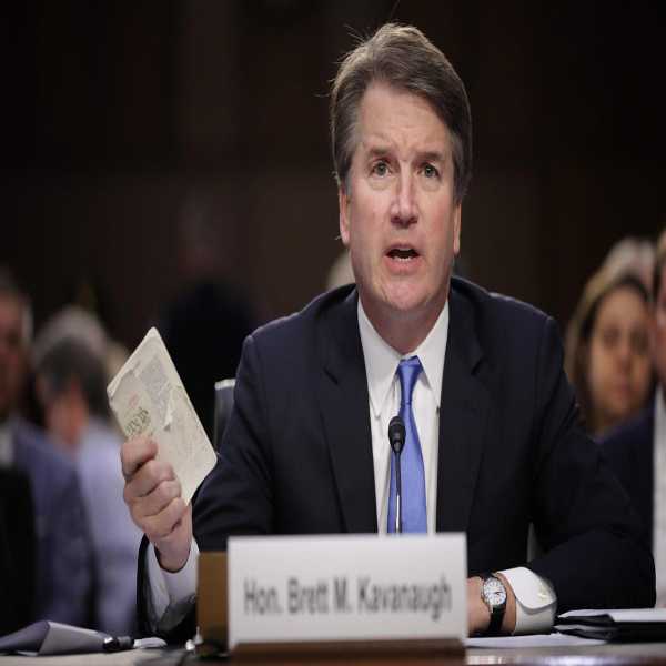 An image of Brett Kavanaugh clutching a document.