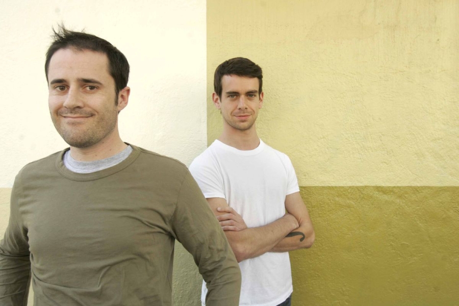 Two young white men in T-shirts, Twitter creators Evan Williams and Jack Dorsey, stand outside their Obvious Corp. office, in San Francisco in 2007.