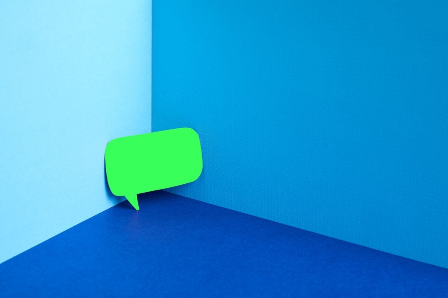 A green text bubble in a corner, surrounded by blue.