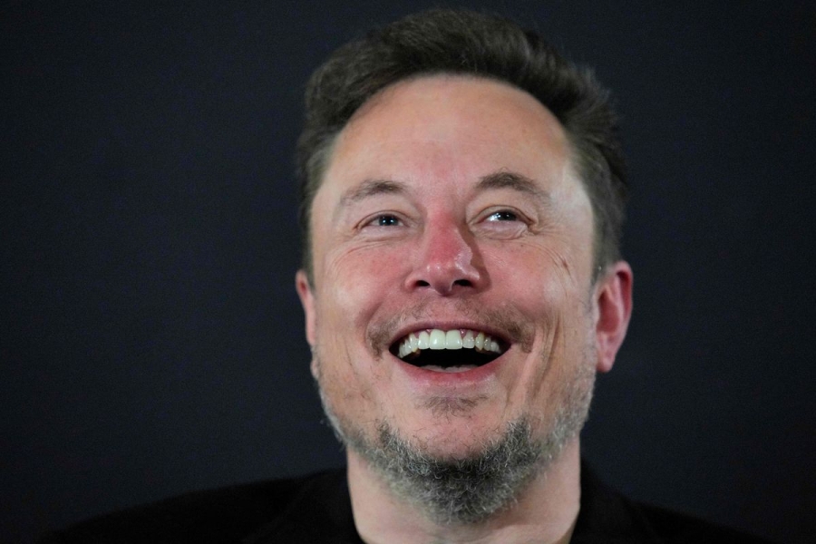 Elon Musk laughing.