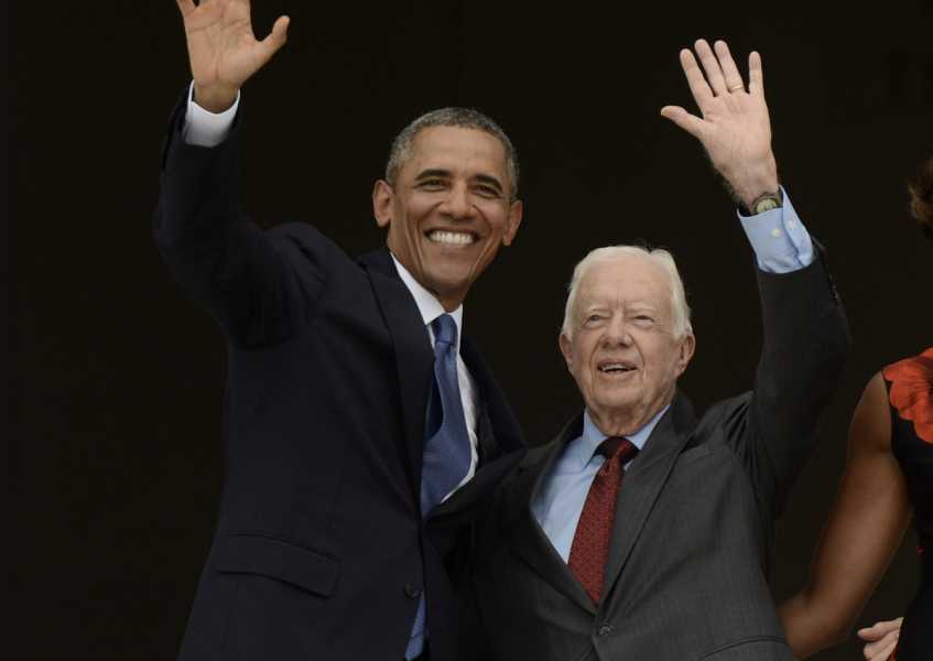 US President Barack Obama and former US President Jimmy Carter wave during the Let Freedom Ring commemoration event at the Lincoln Memorial in Washington, DC, on Wednesday, August 28, 2013.&nbsp;
