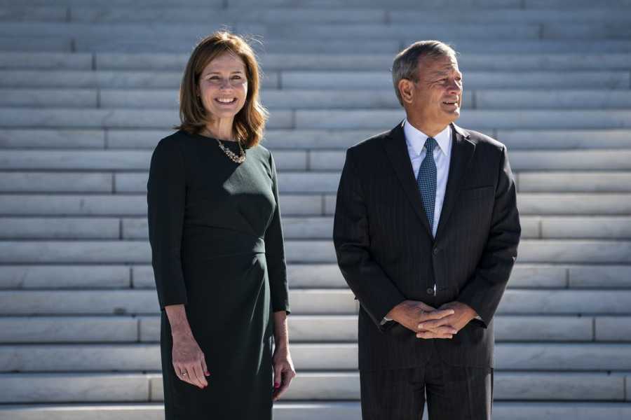 Barrett and Roberts standing in front of the steps of the Supreme Court.