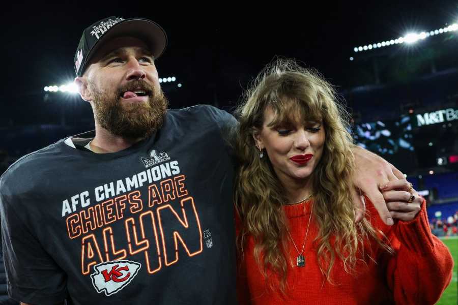 Kelce puts his arm around a smiling Swift on the football field.