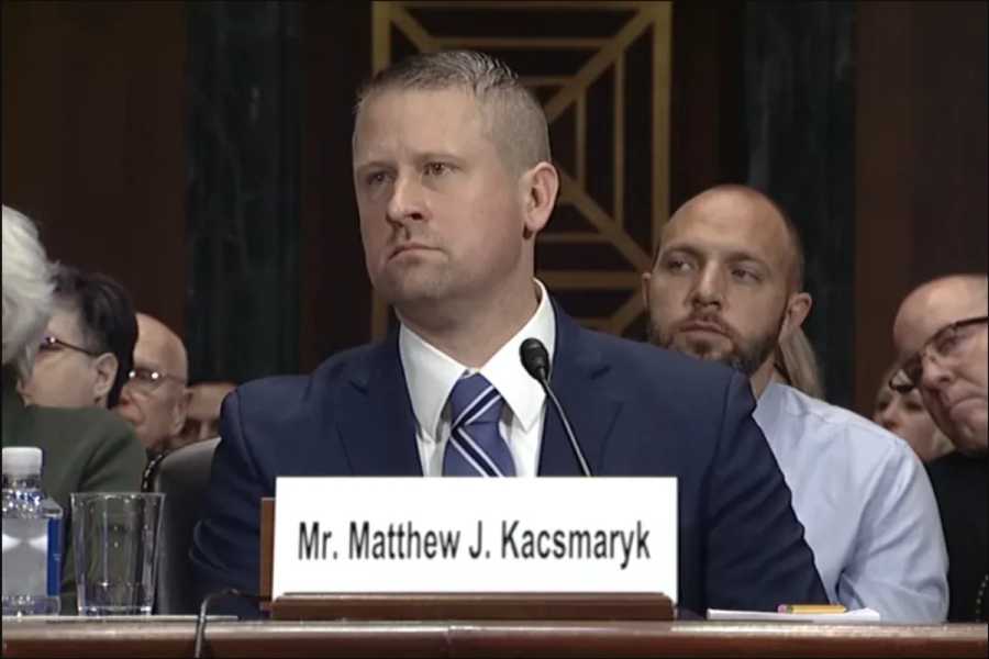 Matthew Kacsmaryk sits in a government hearing.