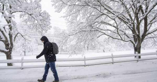 Major outages as US states are battered by snow, rain and high winds