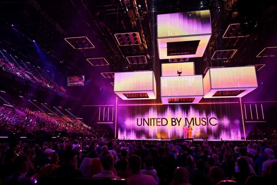 The Eurovision stage with a scrim that reads “United by Music.”