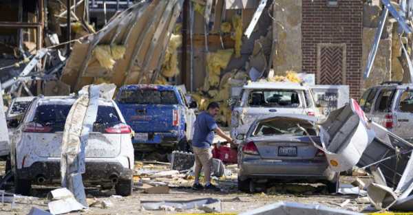 At least 20 dead as storms carve path of destruction across southern US
