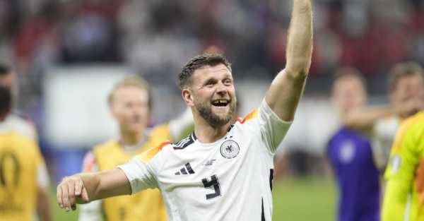 Niclas Fullkrug’s last-gasp header snatches Germany top spot in Group A