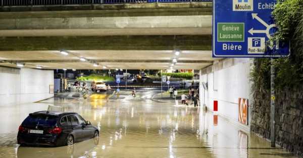 Clean-up begins after sudden storms flood roads and halt air traffic in Geneva