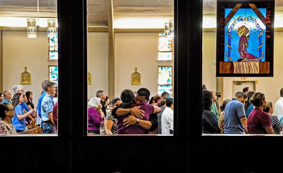 People gather at Sacred Heart Catholic Church to pray for the victims of the mass shooting at Robb Elementary School in Uvalde, Texas, on May 25, 2022.