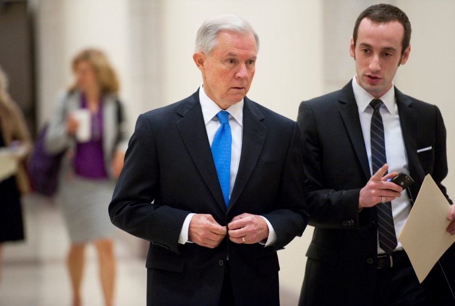 Then-Sen. Jeff Sessions (R-AL) arrives with his aide Stephen Miller for a news conference on April 5, 2011.