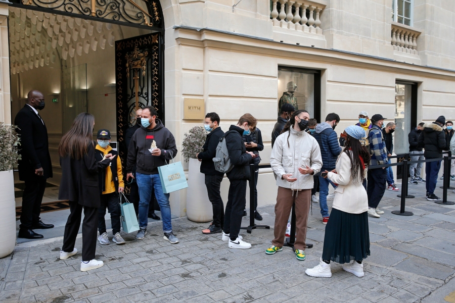 Shoppers line up outside the flagship Kith store in Paris for its grand opening.