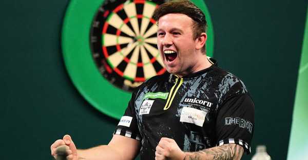 World Darts Championship: Callan Rydz keeps up perfect record to reach last 16