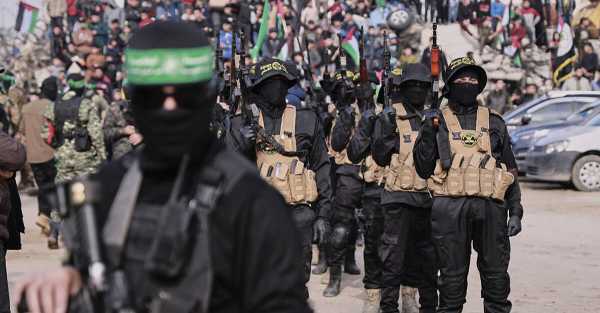 Hamas hands over Israeli hostages after parading them in front of crowd