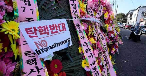 South Koreans turn to flower wreaths and K-pop light sticks as political symbols