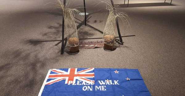 Protests over 'Please Walk Over Me' flag lead to its removal from gallery