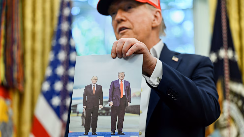 Trump shows off photograph Putin sent him of their Alaska summit