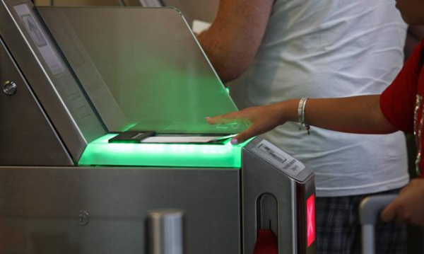 You won't have to remove electronics from your luggage. Chopin Airport is purchasing modern scanners.