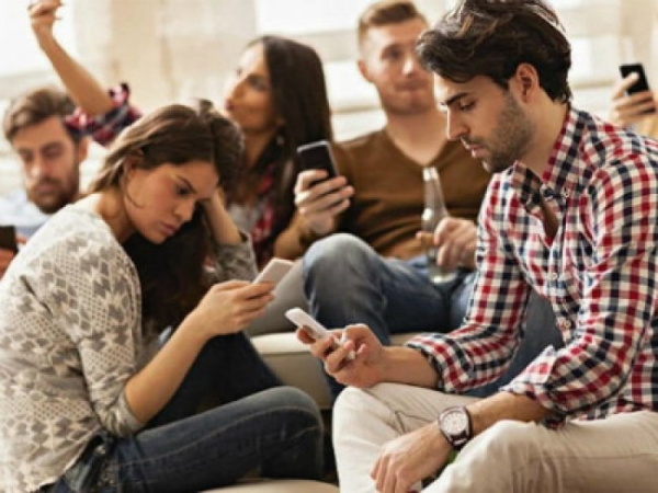 What does the term “phubbing” mean and why has it become a common phenomenon for many?