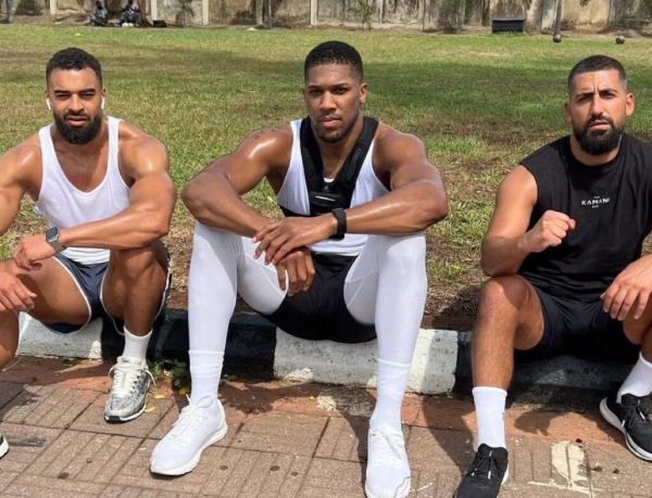 Anthony Joshua with his friends and trainers Robert Lutz and Cena Gami