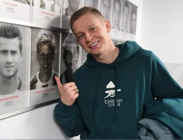 Oleksandr Zinchenko next to his photo at PSV Eindhoven's home arena