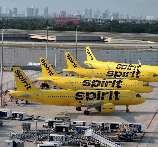 Airlines cut, limit prices for Spirit passengers needing to reschedule grounded trips.