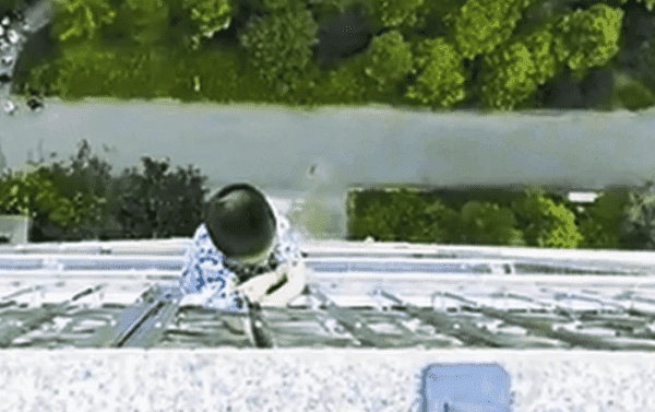 WATCH: Five-Year-Old Dangles from 19th-floor Balcony in China for 30 Minutes