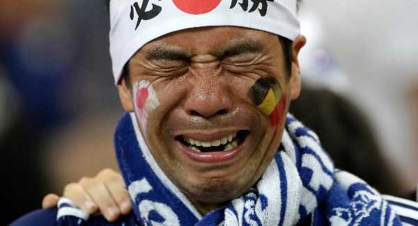 Pics: Japan team leave dressing room spotless and crying fans clean stadium following defeat